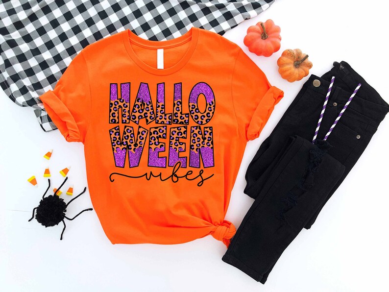an orange shirt with the words halloween written on it