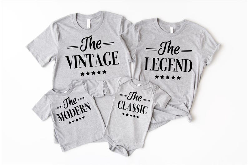 May include: Four grey t-shirts with black text and stars. The shirts say "The Vintage", "The Legend", "The Modern", and "The Classic".