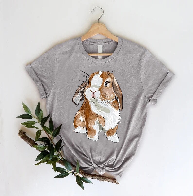 a t - shirt with a picture of a rabbit on it