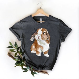 a t - shirt with a picture of a rabbit on it