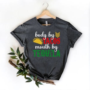 a t - shirt that says body by cross, mouth by tequila