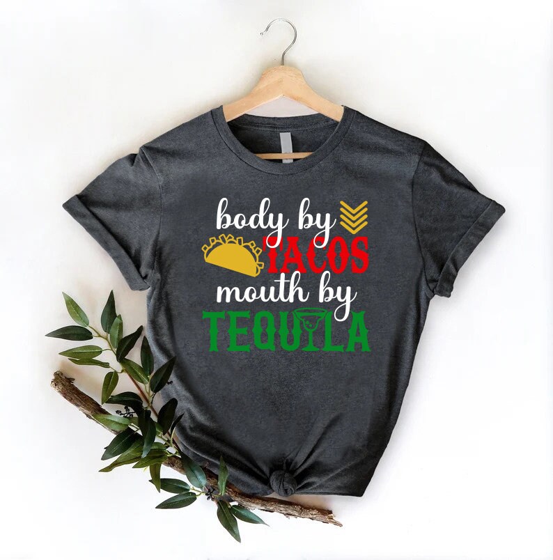 a t - shirt that says body by cross, mouth by tequila