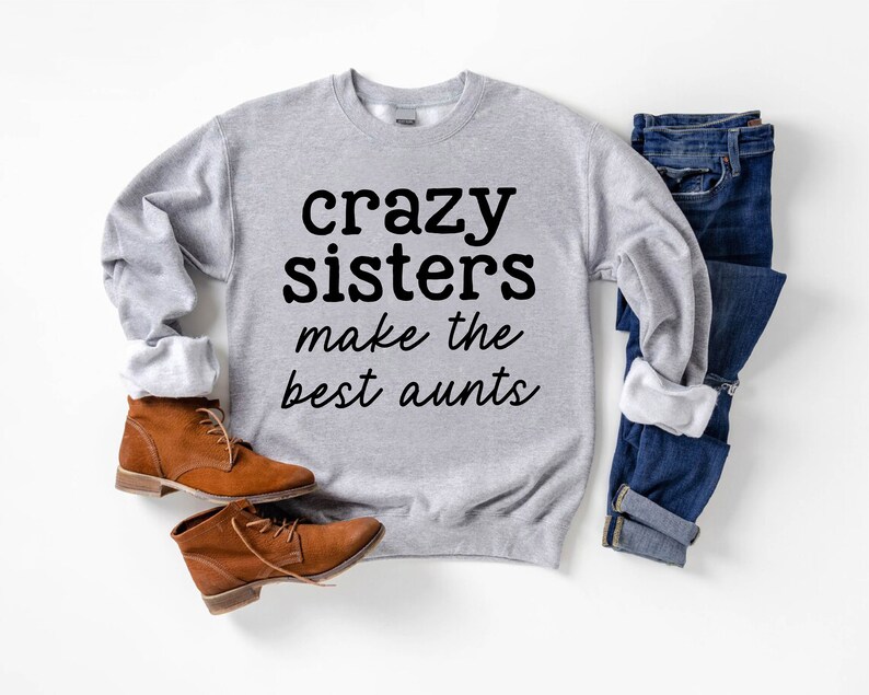 a gray sweatshirt that says crazy sisters make the best pants