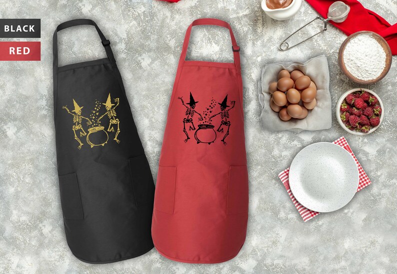 two red and black cooking aprons next to a bowl of eggs