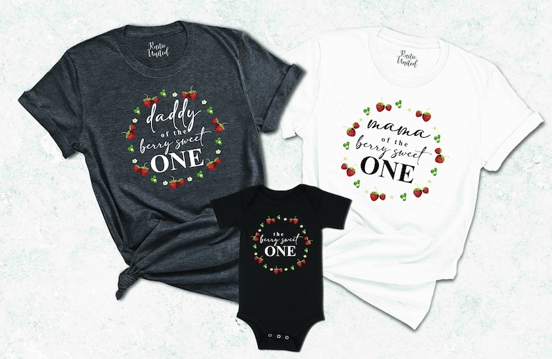 May include: Three t-shirts with a strawberry theme. The adult shirts say "Daddy of the berry sweet one" and "Mama of the berry sweet one". The baby shirt says "The berry sweet one".