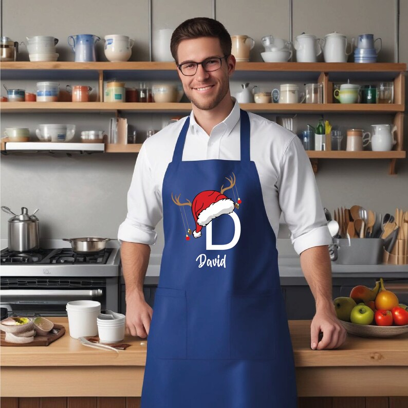 a man wearing an apron and a santa hat