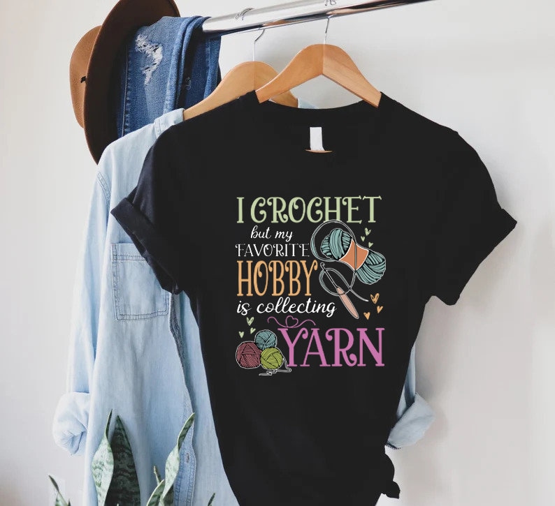 a t - shirt that says i crochet is a hobby is collecting yarn