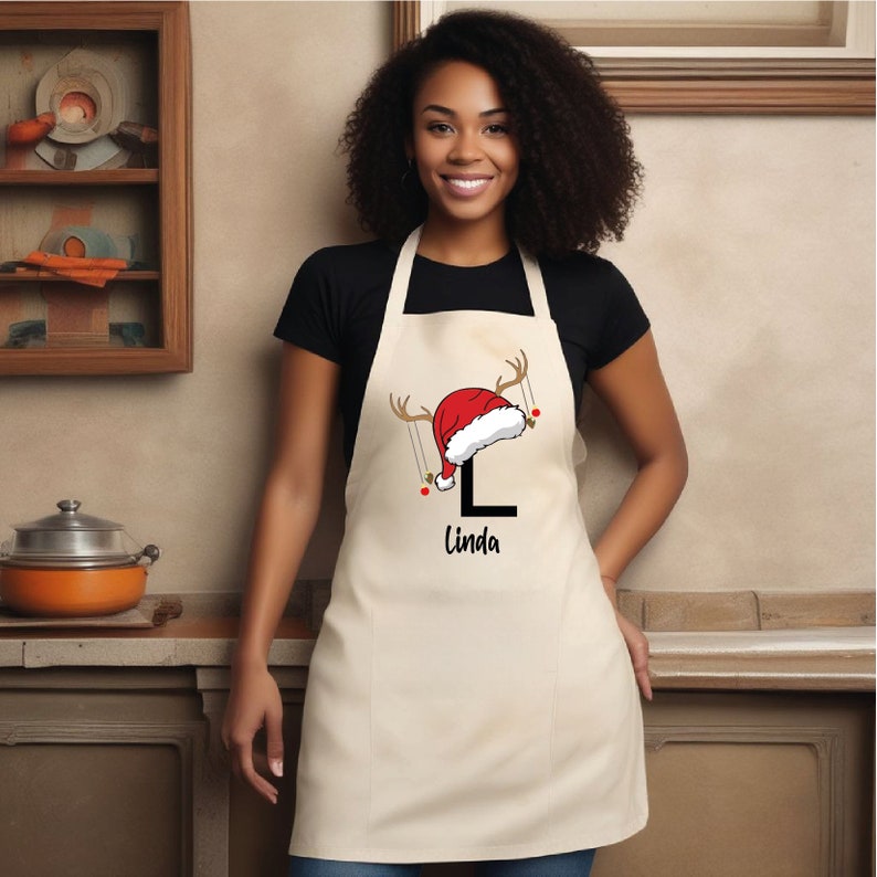 a woman wearing an apron and a santa hat