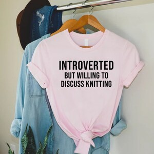 a pink t - shirt that says,'i'm interested, but will