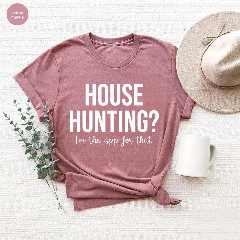 May include: A heather mauve t-shirt with the text "HOUSE HUNTING? I'm the app for that" printed in white.