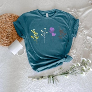 a t - shirt that has flowers on it