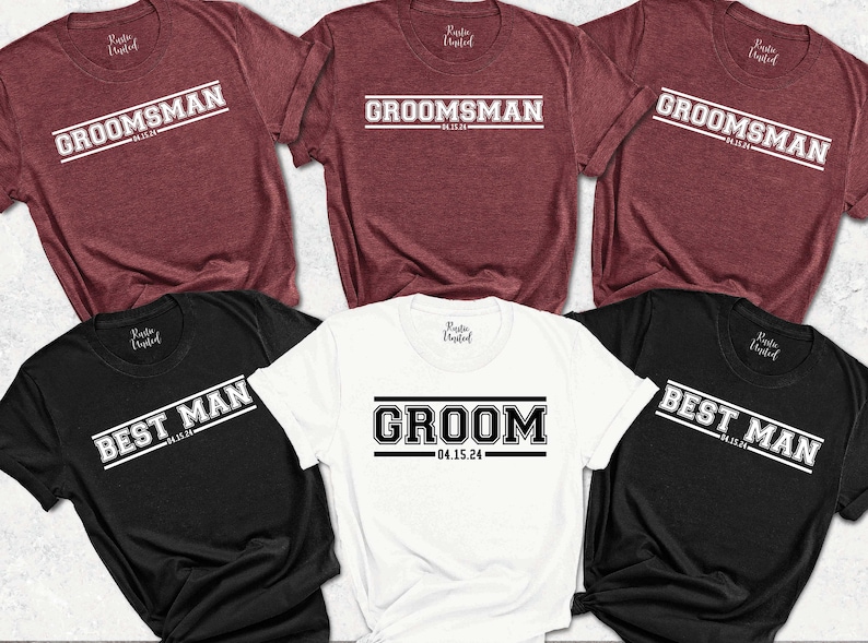 May include: Five t-shirts with different text designs. The shirts are in black, white, and maroon. The text on the shirts includes "Groom", "Best Man", and "Groomsman" with the date "04.15.24".