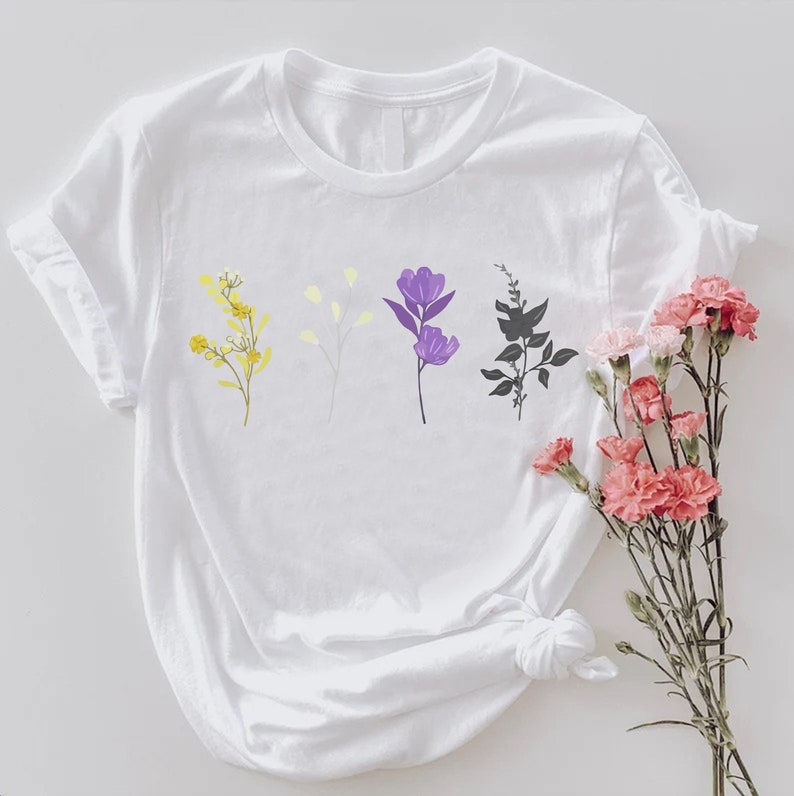 a white t - shirt with flowers on it