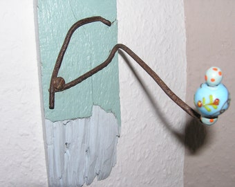 Small wall hook made from found parts, upcycling hook