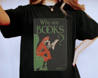 May include: Black oversized t-shirt featuring a vintage graphic print of a woman reading a book. The graphic says "Why not BOOKS?"