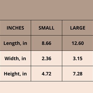 Peut inclure: Un tableau montrant les dimensions d'un produit en pouces. Le tableau comporte trois colonnes&nbsp;: Pouces, Petit et Grand. Les lignes indiquent la longueur, la largeur et la hauteur du produit en pouces. Les mesures pour la petite taille sont de 8,66 pouces de long, 2,36 pouces de large et 4,72 pouces de haut. Les mesures pour la grande taille sont de 12,60 pouces de long, 3,15 pouces de large et 7,28 pouces de haut.