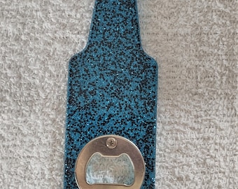 Glow in the dark, blue glitter bottle shaped bottle openers.