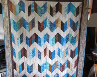 Hand made "Sand and Sea" quilt in blue, teal, tan and brown colors