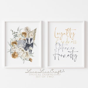 May include: A set of two printable wall art prints. The first print features a watercolor illustration of a badger surrounded by white and yellow flowers. The second print features the words "Loyalty, Kindness, Patience, Honesty" in gold and gray script.