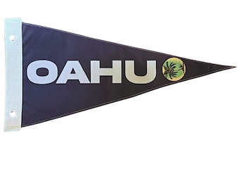 May include: A dark blue pennant flag with white text that reads "OAHU" and a yellow circle with a green palm tree graphic.