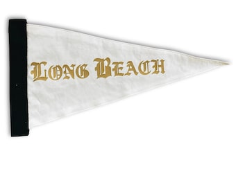 May include: White pennant flag with a black border and gold lettering that reads "LONG BEACH".
