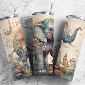 May include: Three stainless steel tumblers with colorful illustrations of elephants, flowers, and buildings. The tumblers are a light beige color with a white background.