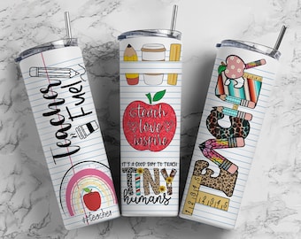 May include: Three white stainless steel tumblers with different designs. The first tumbler has a black and white design with the words "Teacher Fuel". The second tumbler has a red apple with the words "Teach Love Inspire" and the words "It's a good day to teach tiny humans". The third tumbler has a colorful design with the word "Teacher" spelled out with different school supplies.