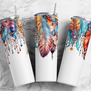 May include: Three stainless steel tumblers with a white background and a colourful design of feathers, beads, and jewels. The design is in shades of blue, orange, red, and gold.