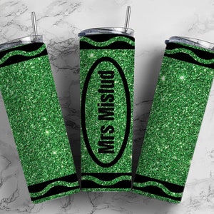 May include: Three green glitter tumbler cups with black lids and straws. The middle cup has the text "Mrs. Mistud" in a black oval.