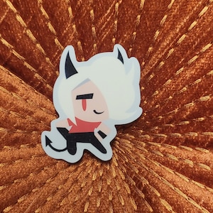 May include: A white and red cartoon character with horns and a tail. The character is wearing a red shirt and black pants. The character is standing on a brown background.