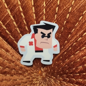 May include: A cartoon sticker of a man with black hair, wearing a white suit with a red cross on the chest, and sunglasses. He has a serious expression on his face.