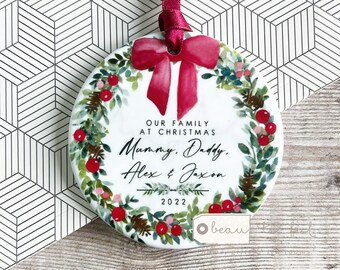 Personalised Christmas Family Names Bow Greenery Wreath Design Ceramic Round Ornament Keepsake
