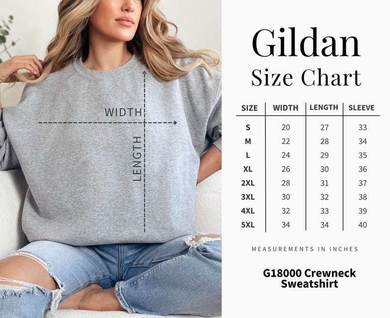K&ouml;nnte beinhalten: Ein hellgraues Gildan G18000 Crewneck-Sweatshirt. Das Bild enth&auml;lt eine Gr&ouml;&szlig;entabelle mit Ma&szlig;en in Zoll f&uuml;r Breite, L&auml;nge und &Auml;rmell&auml;nge, von Gr&ouml;&szlig;e S bis 5XL. Die Tabelle ist mit "Gildan Size Chart" beschriftet.
