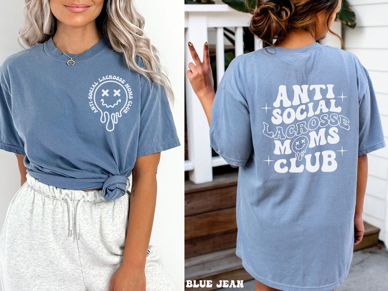 May include: A blue t-shirt with a white graphic that says "Anti-Social Lacrosse Moms Club" and a dripping smiley face with X's for eyes.