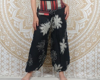 Thani pants. Loose with elastic at the ankles. Wide woven waistband. Black and white print.