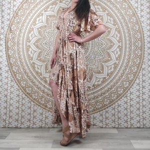 Mylara long asymmetrical dress in Indian silk. Elegant and flowing boho dress. Brown and white floral print with gold insert.