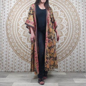 Javeda women's long kimono in Indian silk. Boho kimono with loose sleeves. Black floral print with gold inserts.