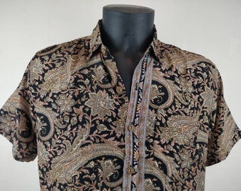 Vintage Garuda shirt in Indian silk. Lightweight and flowing short-sleeved shirt. Black, brown, and pink paisley pattern.