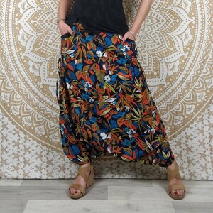 Cotton Haria pants. Harem pants / Adjustable skirt pants with pockets. Black, orange and blue foliage print. image 7