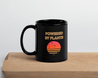 Powered by Plants Black Glossy Mug | Gift for Vegan People | Retro Neon Sunset