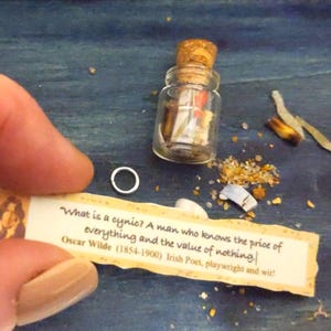Oscar Wilde witty quotes in tiny jar and leatherette pouch; scented and with seashore bits. Message in a bottle. Drift bottle with scroll.
