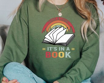 May include: Green sweatshirt with a retro rainbow graphic and the text "Some things are better in a book" and "It's in a book".