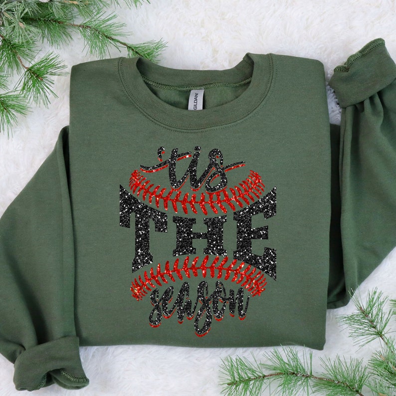 May include: Green sweatshirt with a black and red glitter design that says "Tis the season" with a baseball graphic.