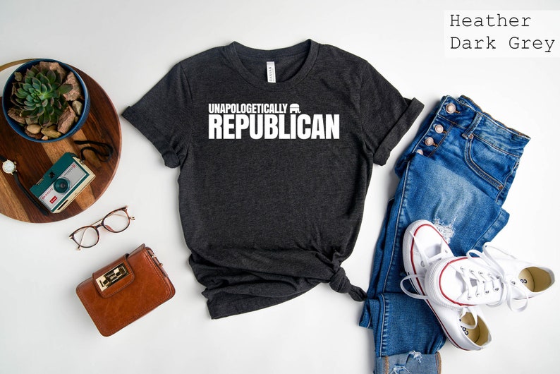 May include: Heather dark grey t-shirt with the text "Unapologetically Republican" in white.