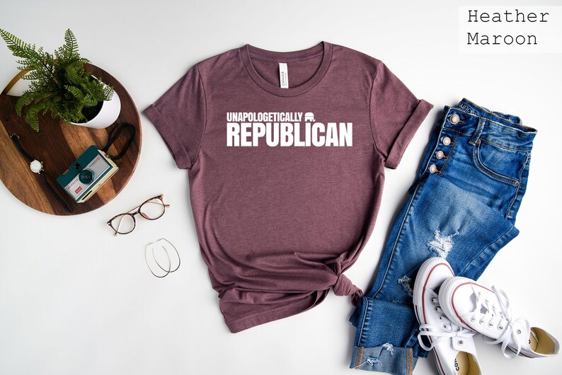 May include: Heather maroon t-shirt with the text "Unapologetically a Republican" printed in white.