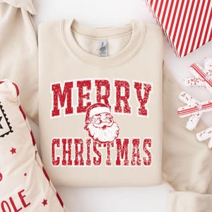 メリークリスマスサンタスウェットシャツ、コラージュクリスマスセーター、レトロサンタクロースセーター、クリスマスユニバーシティシャツ、サンタユニバーシティセーター