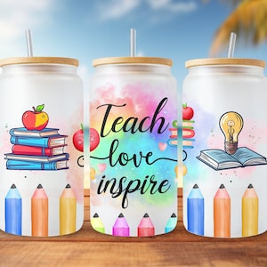 May include: Three white tumblers with a watercolor background and colorful pencils. The tumblers have different designs: one with a stack of books and an apple, one with the text "Teach love inspire", and one with a book and a lightbulb.