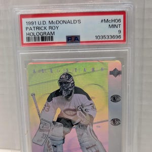 May include: A 1991 U.D. McDonald's All-Stars hockey card featuring Patrick Roy, a goalie, in a green, pink, and yellow holographic design. The card is graded MINT 9 and has the number #McH06.