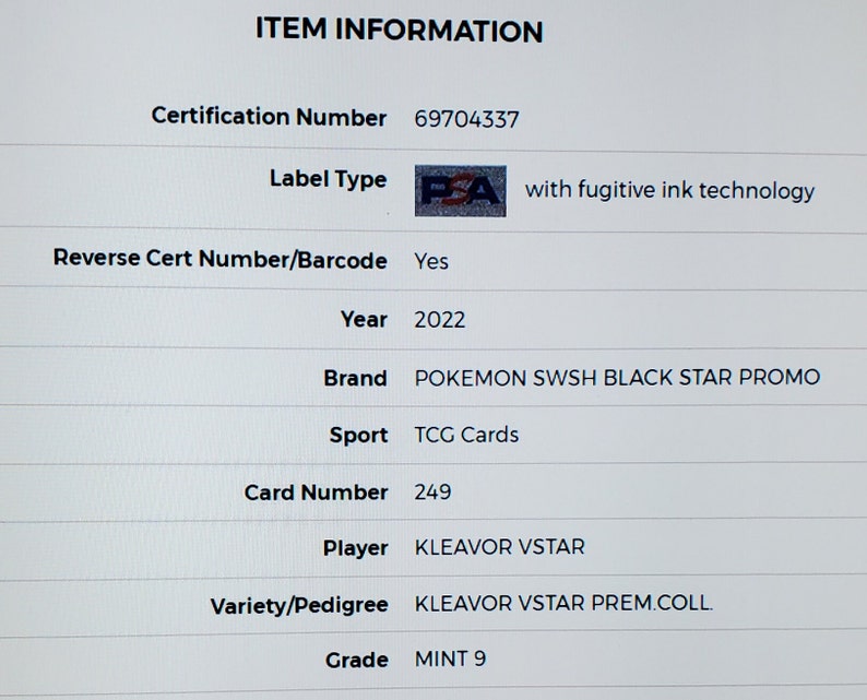 May include: A close-up of a graded trading card for the Pokemon Kleavor VSTAR from the Sword & Shield Black Star Promo set. The card is graded MINT 9 by PSA, a third-party grading company. The card is from 2022 and has a certification number of 69704337.