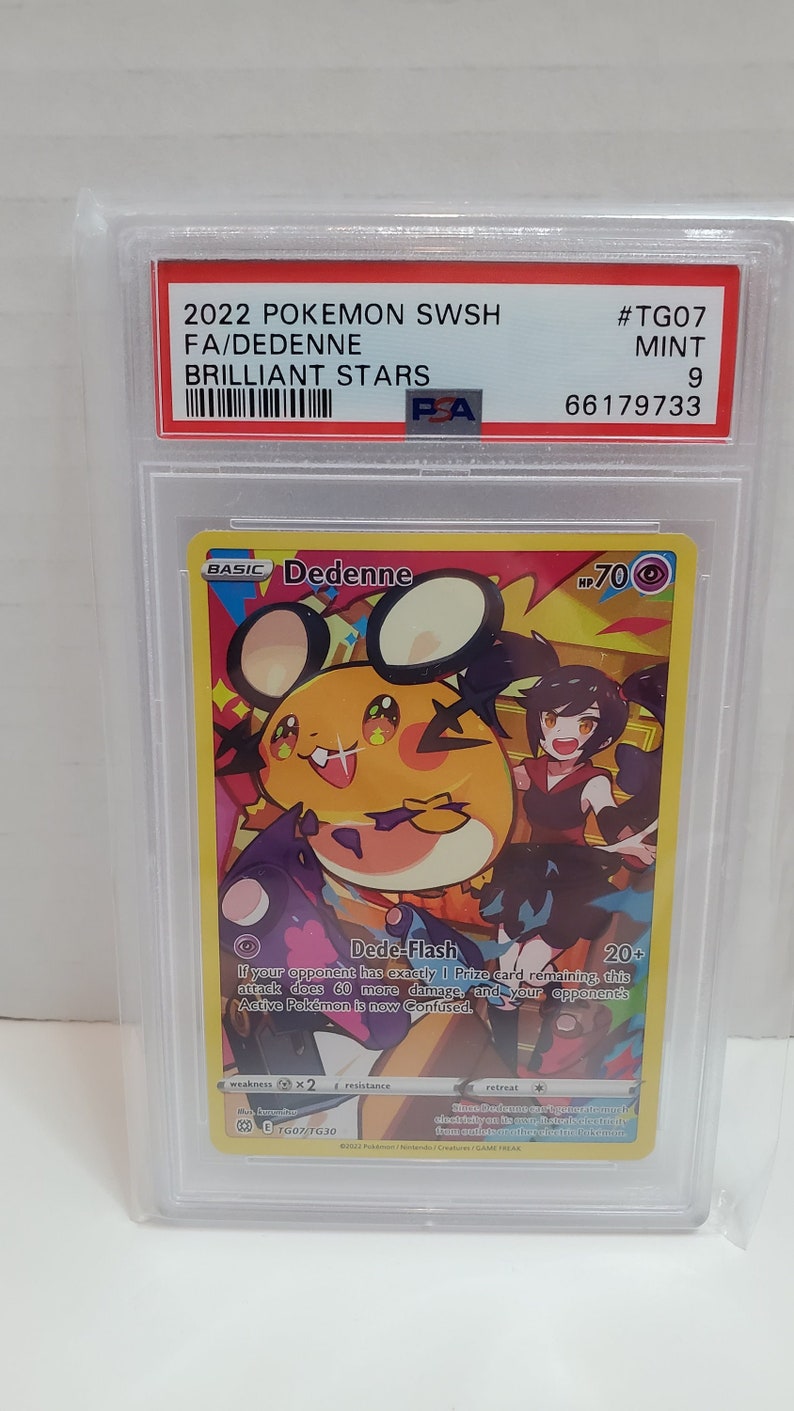 May include: A Pokemon trading card featuring Dedenne, a small, yellow, mouse-like Pokemon with large, black eyes and a pink nose. The card is from the Brilliant Stars set and is graded a 9 by PSA. The card is in mint condition.